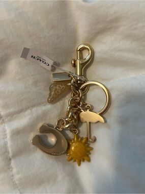 Coach Gold-Tone Charm Keychain with Yellow Sun & Cream Umbrella